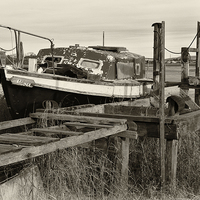 Buy canvas prints of Old Boat And Jetty At Skippool Creek by Gary Kenyon