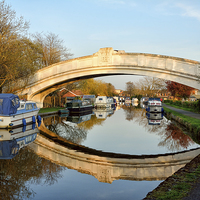 Buy canvas prints of Golden Light On The Lancaster Canal Bridge by Gary Kenyon