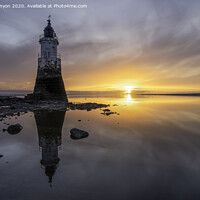 Buy canvas prints of Plover Scar Lighthouse at Sunset by Gary Kenyon
