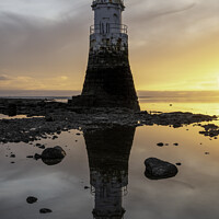 Buy canvas prints of Plover Scar Lighthouse At Sunset by Gary Kenyon