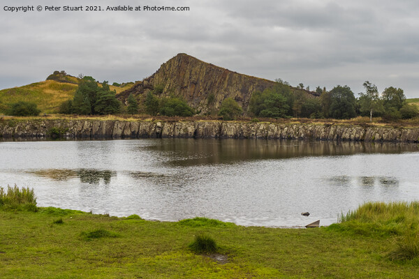 Peel Crags above Once Brewed on Hadrian's Wall Walk Picture Board by Peter Stuart