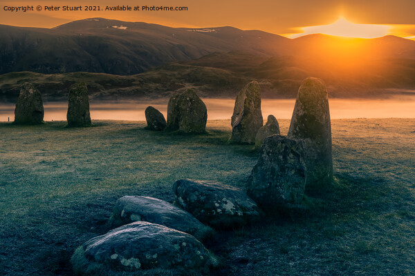 Sunrise at the Winter solstice at Castlerigg Stone Circle near K Picture Board by Peter Stuart