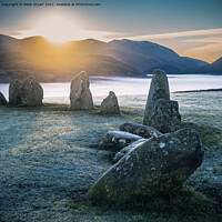 Buy canvas prints of Sunrise at the Winter solstice at Castlerigg Stone Circle near K by Peter Stuart
