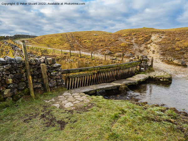 Ford crossing a river on Mastiles Lane near Malham Tarn in the Yorkshire Dales Picture Board by Peter Stuart