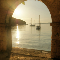 Buy canvas prints of Golden Archway Sunset in Cavtat by David Birchall