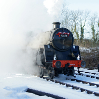 Buy canvas prints of  Steam locomotive 73129 in snow. by David Birchall