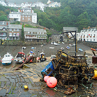 Buy canvas prints of Clovelly harbour after the rain. by David Birchall