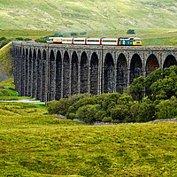 Buy canvas prints of Staycation Express crossing Ribblehead viaduct by David Birchall