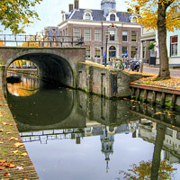 Buy canvas prints of Autumnal canal scene in Edam, Netherlands. by David Birchall