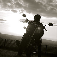 Buy canvas prints of biker at sun set by tom crockford