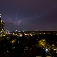 Buy canvas prints of Lightning over KL by Perry Johnson