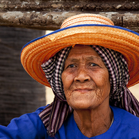 Buy canvas prints of Old lady at Angkor by Perry Johnson