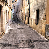 Buy canvas prints of Pollenca Street by Perry Johnson