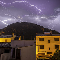 Buy canvas prints of Lightning over the Puig by Perry Johnson