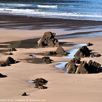 Buy canvas prints of Puddles and Rocks at Putsborough Sands by Rosie Spooner
