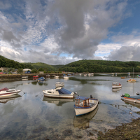 Buy canvas prints of Clouds gather on the River Looe by Rosie Spooner