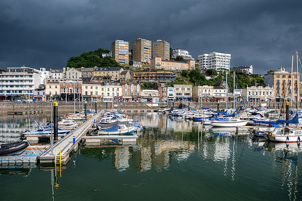 Rain clouds gather over Torquay Harbour Picture Board by Rosie Spooner