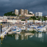 Buy canvas prints of Rain clouds gather over Torquay Harbour by Rosie Spooner