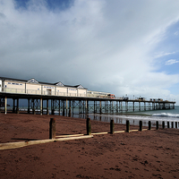Buy canvas prints of  Clouds gather over Teignmouth Pier by Rosie Spooner