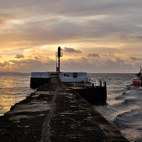 Buy canvas prints of  A fishing boat passes the Banjo Pier at Looe by Rosie Spooner