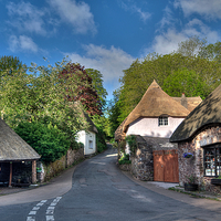 Buy canvas prints of  Cockington Forge and Thatched Cottages at Cocking by Rosie Spooner