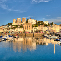 Buy canvas prints of  Golden reflections at Torquay Harbour by Rosie Spooner