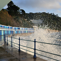 Buy canvas prints of  Rough seas and chalets at Meadfoot Beach Torquay by Rosie Spooner