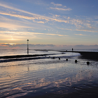 Buy canvas prints of  Sunrise at Low Tide on Teignmouth Beach by Rosie Spooner