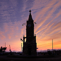 Buy canvas prints of Sunset at Torquay Clocktower  by Rosie Spooner