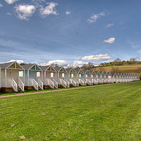 Buy canvas prints of Beach Huts on the green at Broadsands Beach by Rosie Spooner