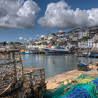 Buy canvas prints of Lobster pots on the quay at Brixham by Rosie Spooner