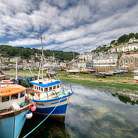 Buy canvas prints of Fishing boats moored on The River Looe at low tide by Rosie Spooner
