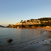 Buy canvas prints of Golden light on Looe Town Beach just after sunrise by Rosie Spooner