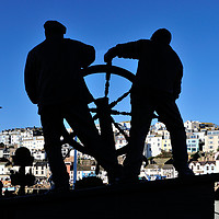 Buy canvas prints of The Man and Boy Statue at Brixham Harbour by Rosie Spooner