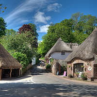 Buy canvas prints of The Old Forge and Thatched Cottages at Cockington  by Rosie Spooner
