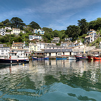Buy canvas prints of Reflections at Polperro Harbour in Cornwall by Rosie Spooner