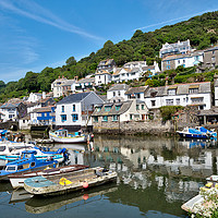 Buy canvas prints of Colourful boats and houses at Polperro Harbour by Rosie Spooner