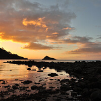 Buy canvas prints of A portrait view of Thatcher Rock at sunrise by Rosie Spooner