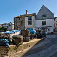 Buy canvas prints of Lobster Pots at Port Isaac in North Cornwall by Rosie Spooner