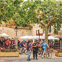 Buy canvas prints of The Busy Plaza At Fornalutx Mallorca by Peter F Hunt