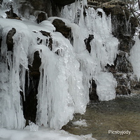 Buy canvas prints of Ice on the Rocks by Pics by Jody Adams