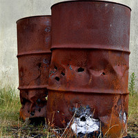 Buy canvas prints of A couple of old rusty oil drums by Gemma Shipley
