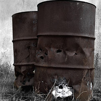 Buy canvas prints of Rusty oil drums in the dark by Gemma Shipley