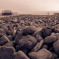 Buy canvas prints of Brighton Pebbles and Pier by Adam Moseley