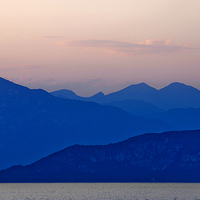 Buy canvas prints of Lake Garda at sun down by Peter Lennon