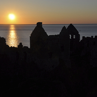 Buy canvas prints of Dunluce Silhouette by Peter Lennon