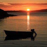 Buy canvas prints of Small Boat In The Sunset by Anne Macdonald