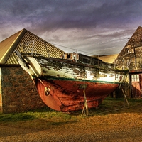 Buy canvas prints of Old Boat and Farm Buildings by Anne Macdonald