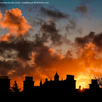 Buy canvas prints of Fiery Sunset Over The Rooftops Of Lerwick, Shetlan by Anne Macdonald
