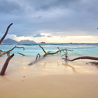 Buy canvas prints of Clouds over a natural sandy beach on La Digue by Silvio Schoisswohl